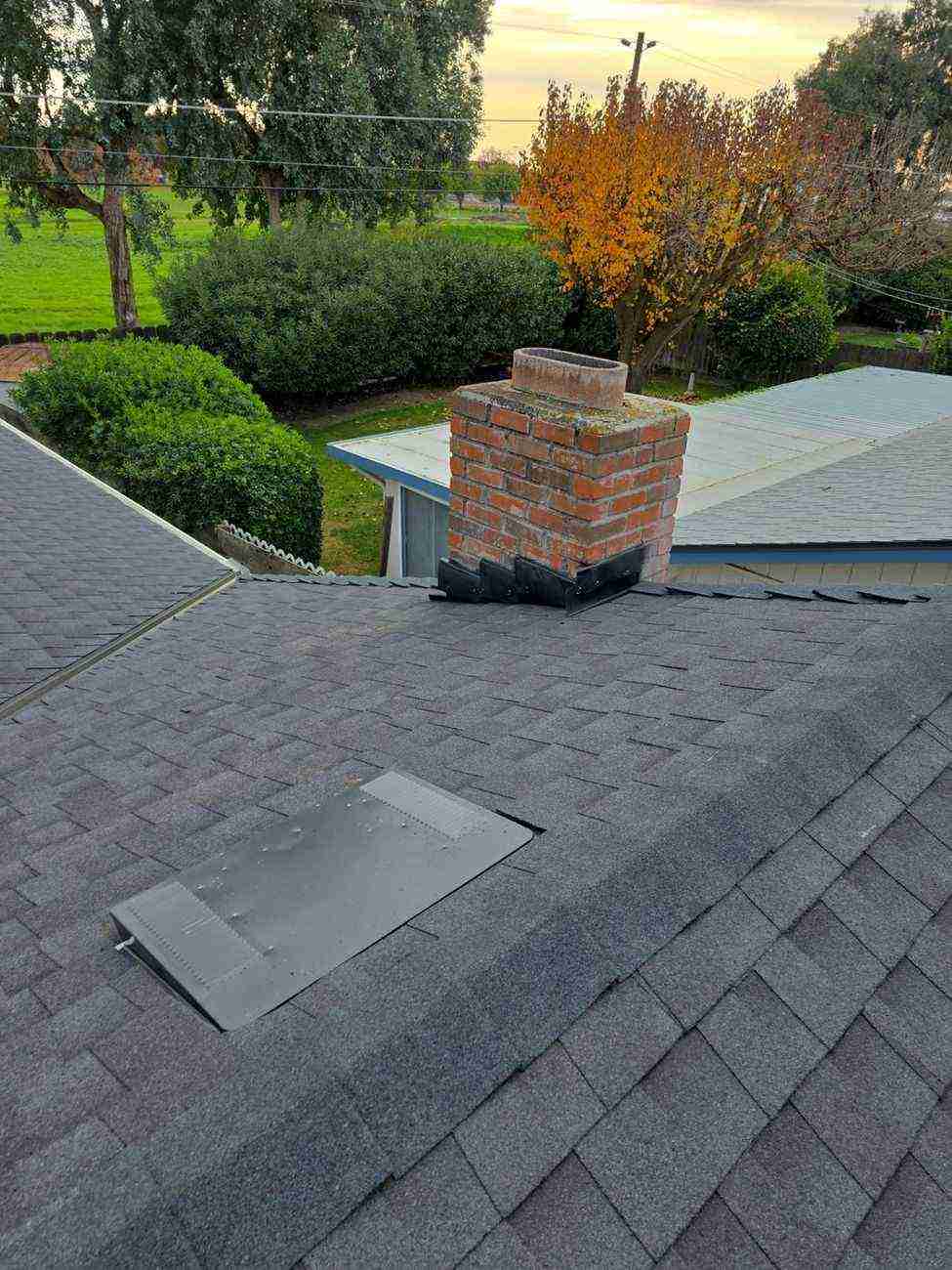 New step and counter-flashing on the brick chimney after the Atwater re-roof