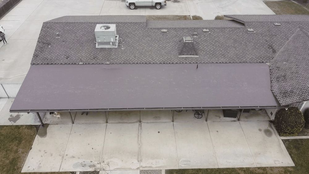 Aerial view of a flat commercial roof completed by Econo Roofing