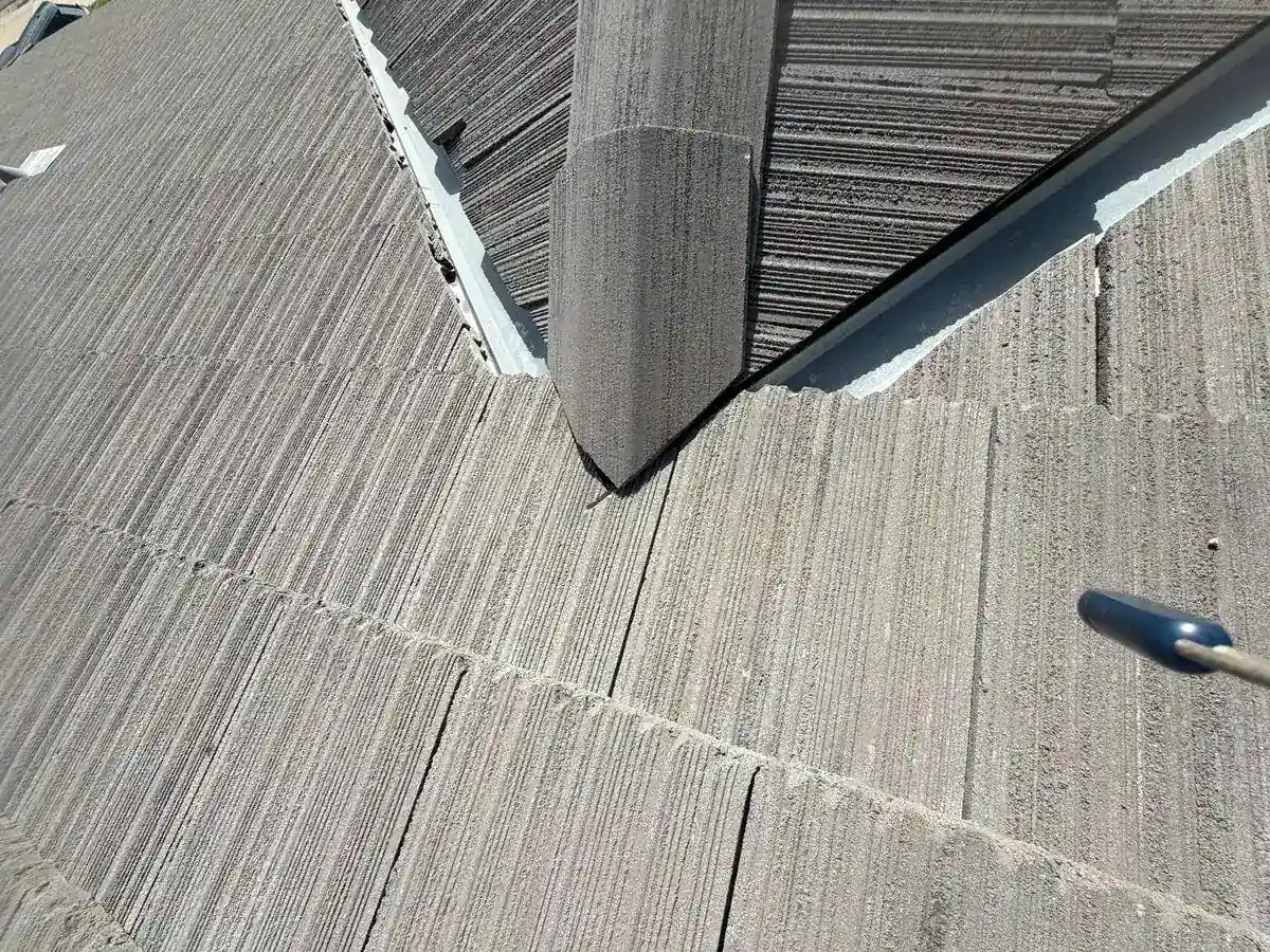 Gustine tile roof before repair — cracked, displaced roof tiles