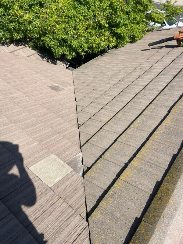 Completed concrete tile roof repair at the hip-and-valley junction in Riverbank, CA