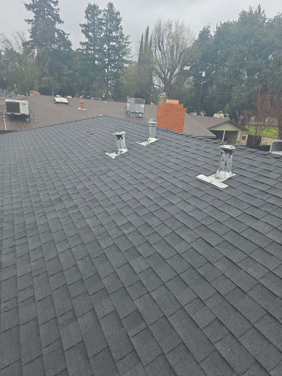 Clean asphalt shingle roof after Econo work in Turlock